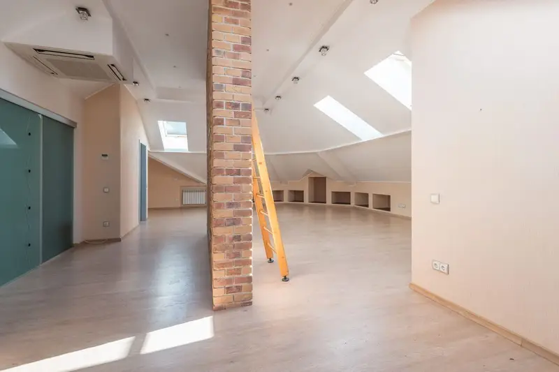 Bright finished loft room with roof windows